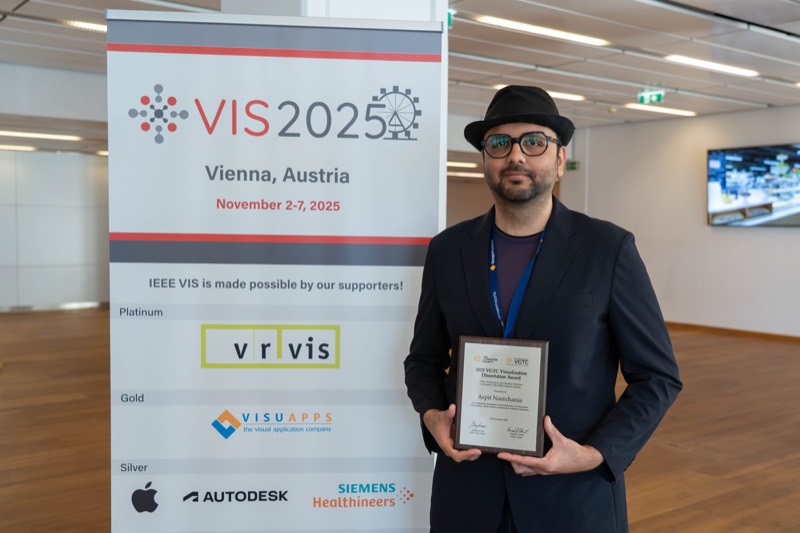 Arpit Narechania holding the IEEE VGTC Visualization Dissertation Award at IEEE VIS 2025 in Vienna